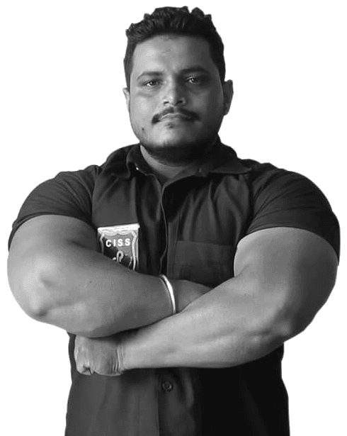 A CISS officer in branded uniform, arms folded