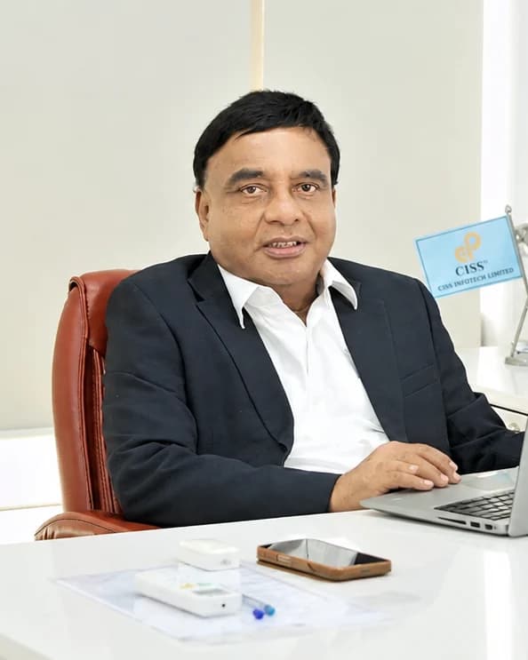 Shri R N Pimple, Chairman of the CISS Group Companies, seated at his desk in the CISS corporate office