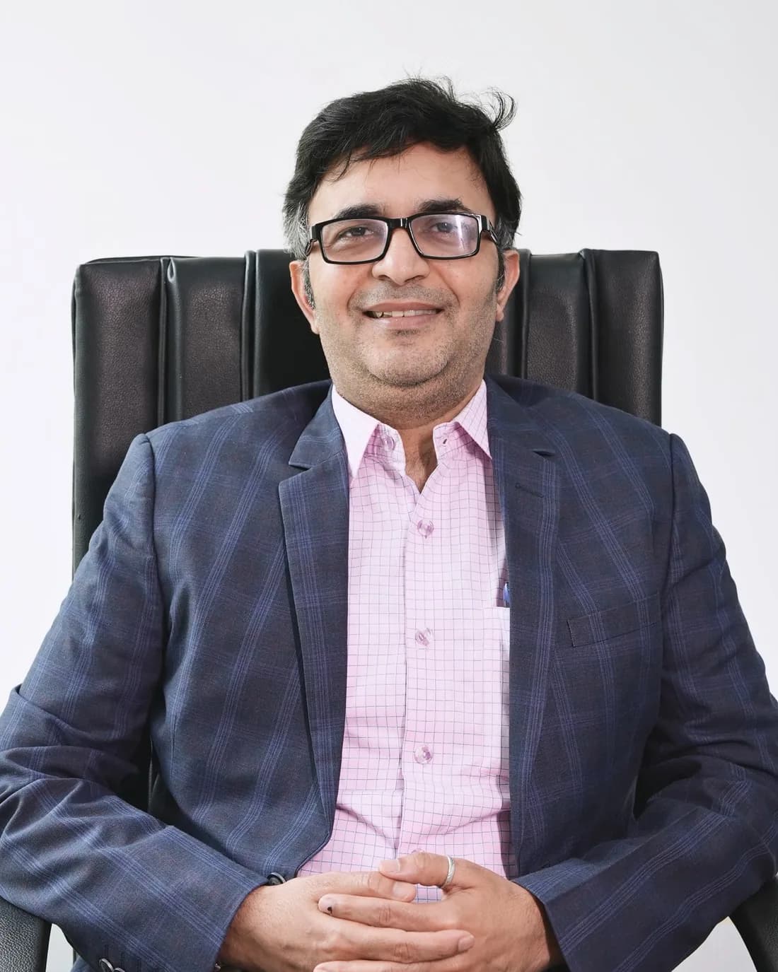 Mr. Santosh Kushwah, Executive Vice President, seated at his desk