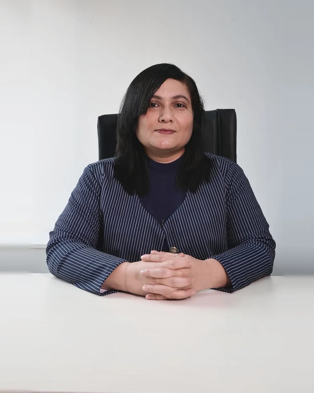 Sheryl Dcunha, DGM (Head) – Drone, Training, Technical Services, seated at her desk