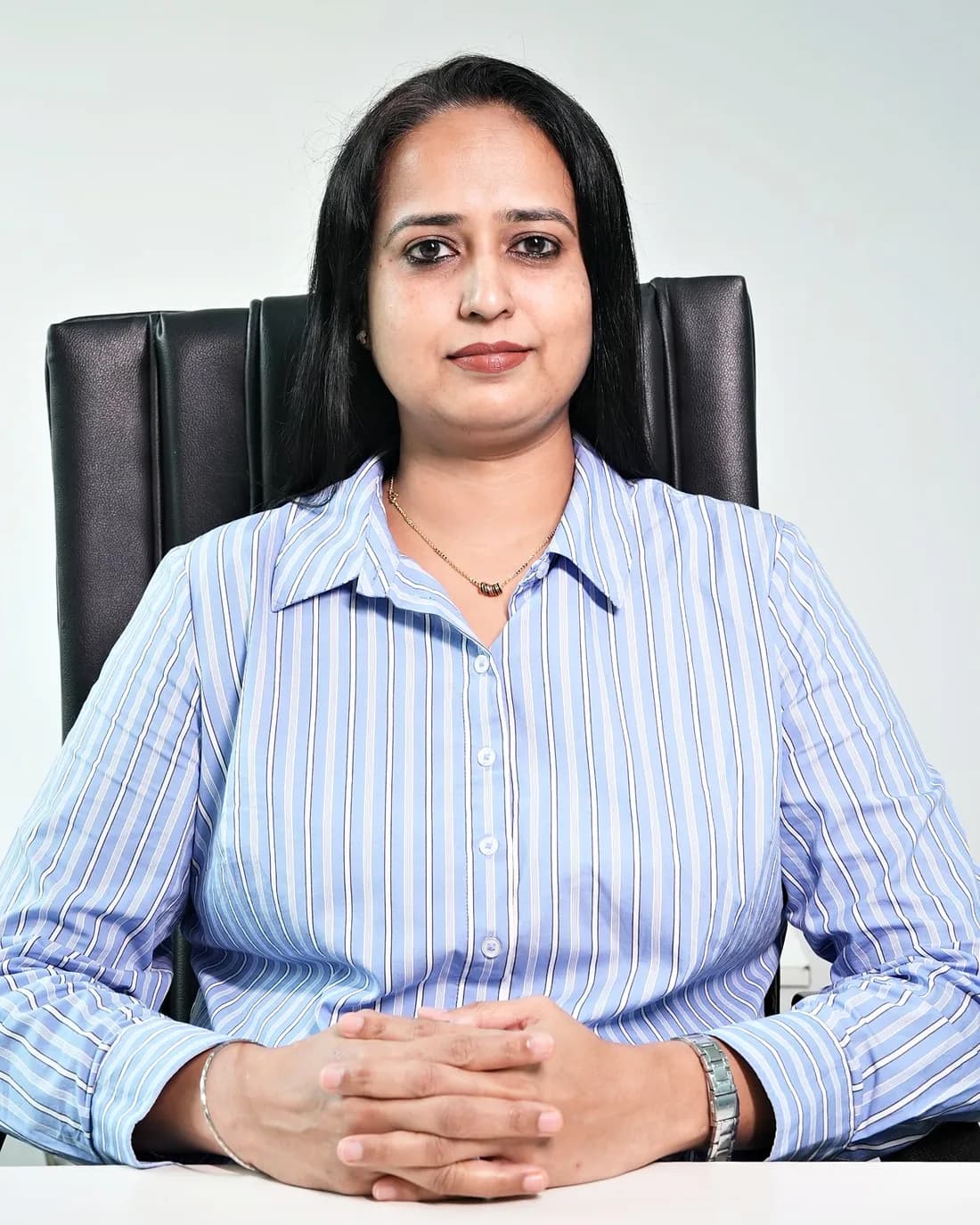 Ms Shraddha More, Vice President – Talent Acquisition & Development, seated at her desk