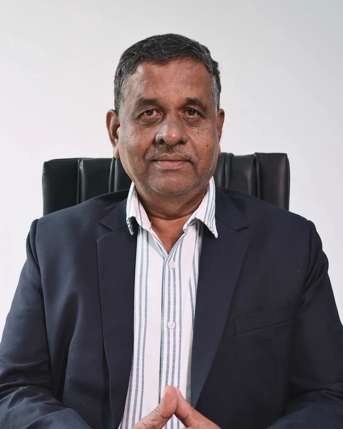 Mr. Yogendra Upadhyay, Vice President & Head – Taxation & Compliance, seated at his desk