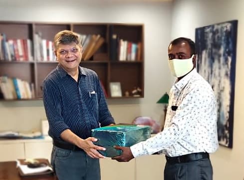 Arvind Denim CEO felicitating CISS Security Supervisor Paresh Kanojia